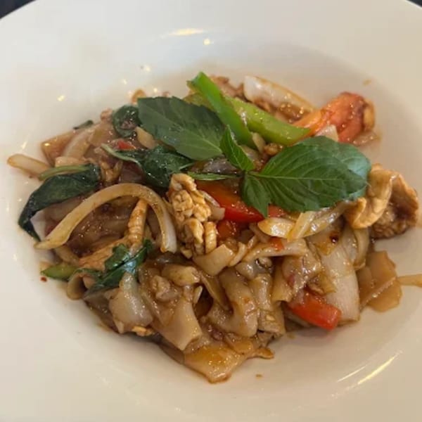 Zato Thai Cuisine & Sushi Bar's Pad See Ew with wide noodles, chicken, and vegetables.