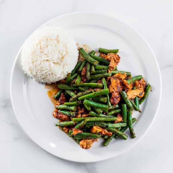 Zato Thai Cuisine's spicy green bean and chicken stir-fry with a side of white rice.