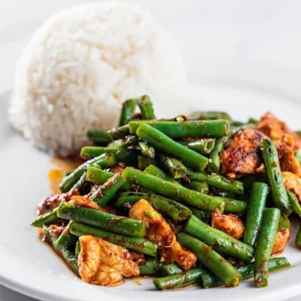 Zato Thai Cuisine's green bean and chicken stir-fry with a side of white rice.