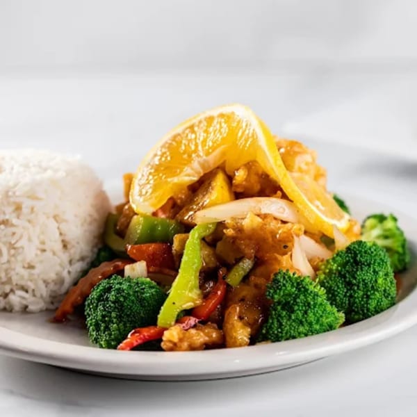 Zato Thai Cuisine & Sushi Bar's orange chicken with broccoli, bell peppers, onions, and white rice.