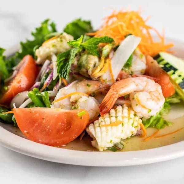 Zato Thai Cuisine & Sushi Bar's seafood salad with shrimp, squid, tomatoes, and greens.